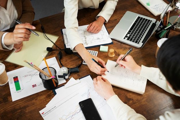 people working in elegant and cozy office space free photo
